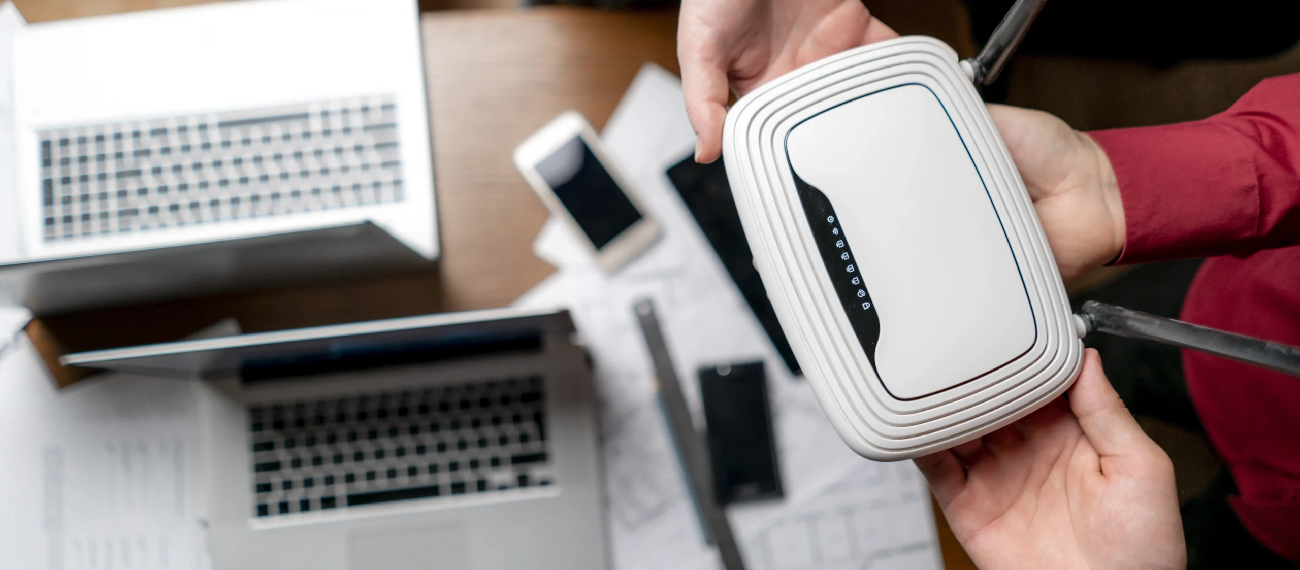 top view of group of people hold wifi router wireless networking 2025 top view of group of people hold wifi router wireless networking 2025